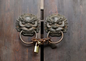 photo locked gate with lion knobs 